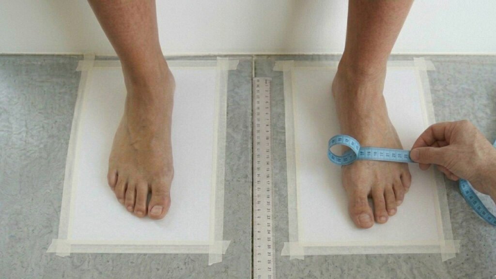 Measuring one foot with a tape
